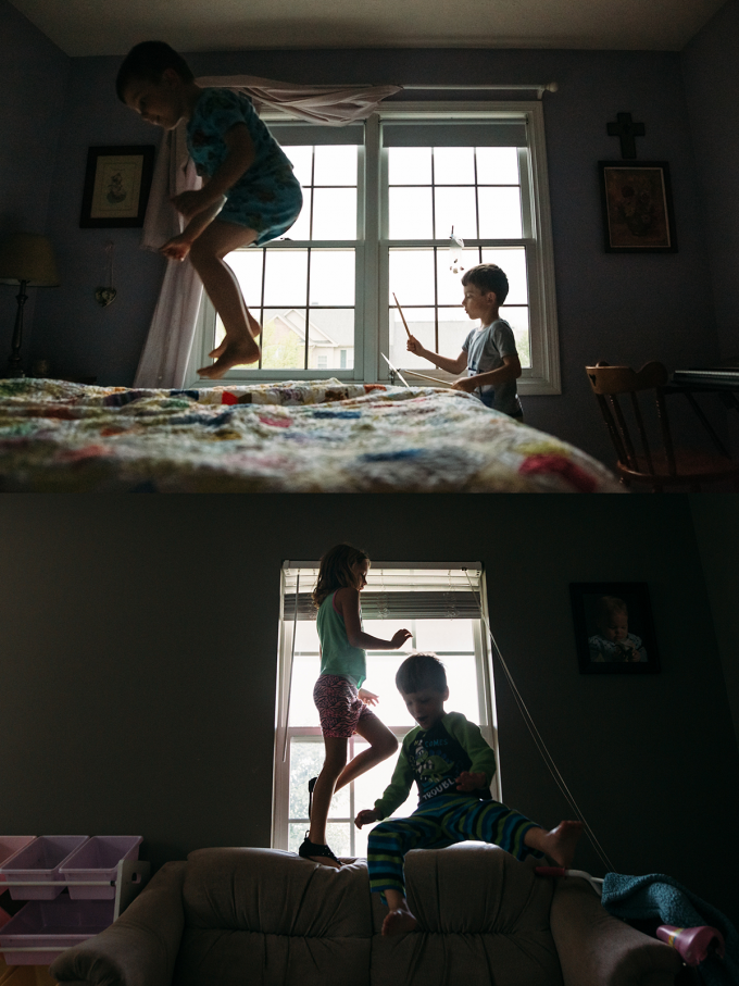 Documentary photography style shot of two kids jumping on a couch.