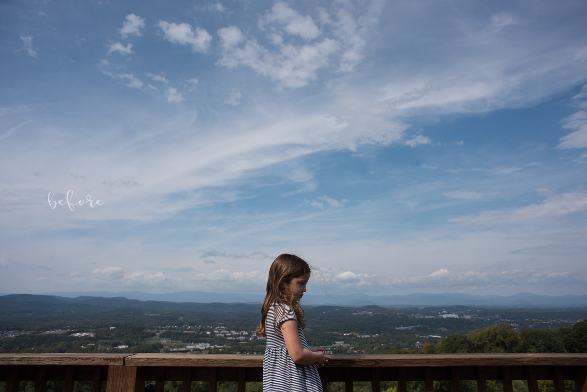 Child standing on a platform with a vast landscape in the back ground including a bright blue sky. Image shows how to properly expose faces in hard light. 