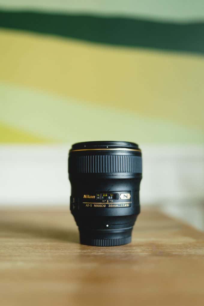 Photo of a black 35mm prime lens for lens comparison. 